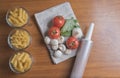 Variety of pasta with tomatoes, basil, mushrooms and garlic Royalty Free Stock Photo