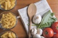 Variety of pasta with tomatoes, basil, mushrooms and garlic Royalty Free Stock Photo