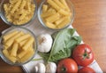 Variety of pasta with tomatoes, basil, mushrooms and garlic Royalty Free Stock Photo