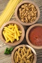 Variety of Pasta Wooden Bowls Cutting Boards Marinara Sauce Royalty Free Stock Photo