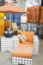 Variety of patio umbrellas and seating furniture in garden furniture store