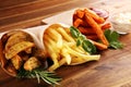 Variety of potatoes with fries. potato wedges, french fries, sweet potato for lunch on table Royalty Free Stock Photo