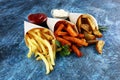 Variety of potatoes with fries. potato wedges, french fries, sweet potato for lunch on table Royalty Free Stock Photo