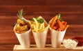 Variety of potatoes with fries. potato wedges, french fries, sweet potato for lunch on table Royalty Free Stock Photo