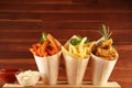 Variety of potatoes with fries. potato wedges, french fries, sweet potato for lunch on table