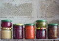 Variety of preserved food in glass jars - pickles, jam, marmalade, sauces, ketchup. Preserving vegetables and fruits. Fermented Royalty Free Stock Photo