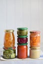 Variety of preserved food in glass jars - pickles, jam, marmalade, sauces, ketchup. Preserving vegetables and fruits. Fermented fo