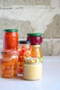 Variety of preserved food in glass jars - pickles, jam, marmalade, sauces, ketchup. Preserving vegetables and fruits. Fermented fo Royalty Free Stock Photo