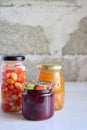 Variety of preserved food in glass jars - pickles, jam, marmalade, sauces, ketchup. Preserving vegetables and fruits. Fermented fo Royalty Free Stock Photo