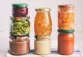 Variety of preserved food in glass jars - pickles, jam, marmalade, sauces, ketchup. Preserving vegetables and fruits. Fermented Royalty Free Stock Photo