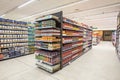 Variety of preserved foods, pasta and other canned products. Supermarket shelves. Royalty Free Stock Photo