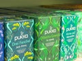 Variety of pukka herbal tea boxes with bright packaging on display shelf Royalty Free Stock Photo
