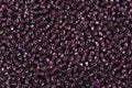 Variety of purple seed beads.