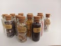 Variety of rocks and stones in glass bottles Royalty Free Stock Photo