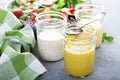 Variety of salad dressings in glass jars Royalty Free Stock Photo