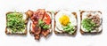 Variety of sandwiches for breakfast, snack, appetizers - avocado puree, fried egg, tomatoes, bacon, cheese, smoked mackerel Royalty Free Stock Photo