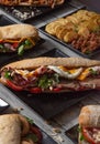 Variety of sandwiches on wooden table. A la carte restaurant. Mediterranean foods