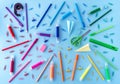 Variety of school supplies in rainbow colors on pastel blue background. Back to school concept. Flat lay. Royalty Free Stock Photo