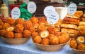 A variety of scotch eggs and other savoury pastry snacks on display at Broadway Market in East London