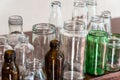 Variety shape and color of empty glass container bottles, reuse things concept Royalty Free Stock Photo