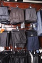 Variety of formal pants hanging on hanger at store