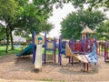 Variety of slide and swing at Colorful playground near residential neighborhood in Richardson, Texas, USA