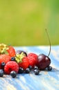 Variety of soft fruits, strawberries, raspberries, cherries, blueberries on table Royalty Free Stock Photo