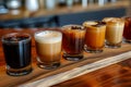 Assorted mini coffee flight sampler on wooden table for tasting Royalty Free Stock Photo
