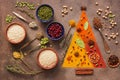 A variety of spices, cereals, beans, seeds on a dark background. Abstract christmas tree. Top view Royalty Free Stock Photo