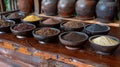 Assorted Spices Displayed in Small Bowls on Wooden Table for Culinary and Ingredient Concept Royalty Free Stock Photo