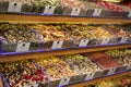 A variety of spices and savories on the counter at the store. Variety of aromatic spices in stores Royalty Free Stock Photo