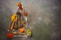 A variety of spices in spoons in the shape of a Christmas tree on a dark rustic background. Abstract christmas tree. Top view, Royalty Free Stock Photo