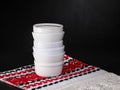 White creal and soup bowls stacked on a black table Royalty Free Stock Photo