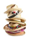 Variety of straw hats stacked vertically