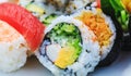 Variety of sushi with cucumber maki, sea cabbage and salmon maki