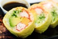 Variety of sushi with cucumber maki, sea cabbage and salmon maki