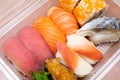 Variety of sushi in plastic box for delivery service. Food delivery concept. Japanese traditional food