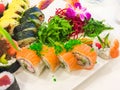 Variety of sushi rolls on a white plate Royalty Free Stock Photo