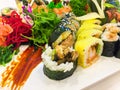 Variety of sushi rolls on a white plate Royalty Free Stock Photo