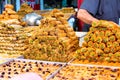 Variety of sweets on the arab street market stall. Eastern sweets in a wide range, baklava, Turkish delight with almond, cashew an Royalty Free Stock Photo