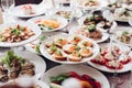 Banquet table served with various cold snacks and salads. Royalty Free Stock Photo