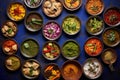 Variety traditional Indian dishes on the wooden table, selection of assorted spicy food, top view Royalty Free Stock Photo