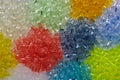 variety of transparent dyed plastic granulates