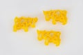 Pasta in shape of animals on a white background. Cows, domestic animals