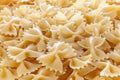 Variety of types and shapes of Italian pasta. Dry pasta background. A portion of Farfalle bows pasta isolated on white . Heap of Royalty Free Stock Photo