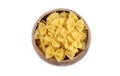 A variety of types and shapes of Italian pasta. Dry pasta bows farfalle. Heap of bow tie macaroni isolated on white background. Royalty Free Stock Photo