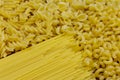 Variety of types and shapes of raw italian pasta Royalty Free Stock Photo