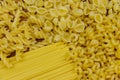 Variety of types and shapes of raw italian pasta. Close-up Royalty Free Stock Photo