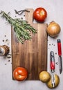 Variety of vegetables, ingredients for cooking, laid out around a cutting board wooden rustic background top view close up Royalty Free Stock Photo