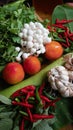 Variety of vegetables, mushrooms, tomatoes, peppers, garlic, green leafy vegetables .